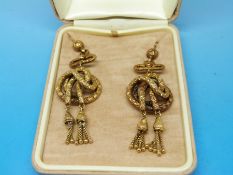 A pair of yellow metal Victorian/ Edwardian earrings of knot design with a textured finish