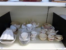A collection of ceramics to include jelly moulds and a tea service