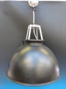 Twenty eight industrial aluminium hanging lights with a black powder coat finish to the outside.