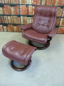 An Ekornes stressless leather chair and footstool