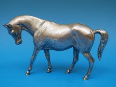 A hallmarked silver horse, probably London 1972 but somewhat indistinct, maker James R.