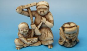 A Japanese ivory okimono of a washer woman and a boy together with a bone netsuke