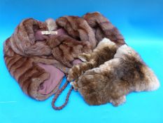 A ladies fur shrug and fur gloves