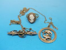 A 9ct gold Pisces pendant on 9ct gold chain,