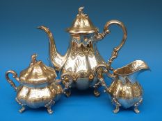 A white metal three piece tea set, each stamped 830 S,