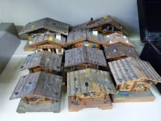 Eight chalet style musical boxes, two chalet style musical barometers,