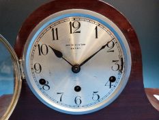 A Mitre cased 1930s two train mantel clock with silvered dial,
