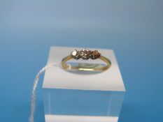 WITHDRAWN 
A yellow metal ring marked 18ct gold set with three diamonds (size L)
