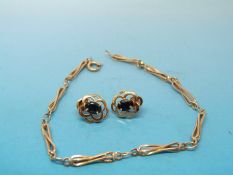 A pair of 9ct gold earrings and a 9ct gold bracelet (5.