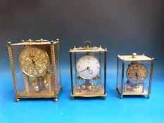 Three carriage style anniversary clocks