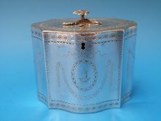 A Georgian hallmarked silver tea caddy of shaped neoclassical form with bright cut decoration,