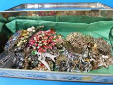 A collection of costume jewellery to include brooches, a micro mosaic, pietra dura brooch,