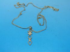A 9ct gold Welsh love spoon pendant on a 9ct gold chain