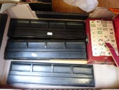 A cased bone and bamboo Mah Jong set with holders and instructions