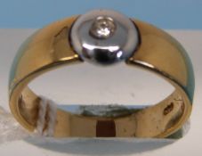 An 18ct gold ring set with a diamond in a platinum mount (size L)