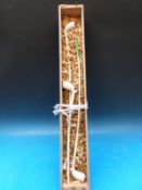 Three very long clay pipes,