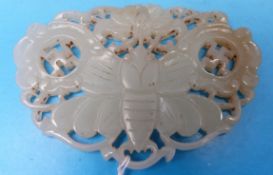 A Chinese celadon jade butterfly pendant with openwork carving and pale russet inclusion (6.