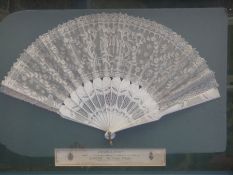 A framed and glazed Duvelleroy lace fan