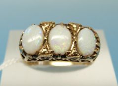 A 9ct gold ring set with three opals (size K)