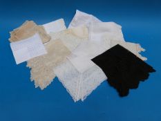 A collection of lace including handkerchiefs