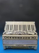 A Coronado 1930s 96 bass piano accordion, in ivory pearloid finish,