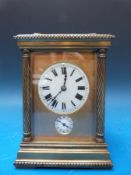 A late 19th/ early 20th century brass carriage clock with strike and alarm mechanism,
