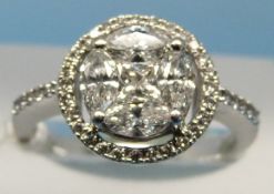 An 18ct white gold ring set with a princess cut diamond surrounded by four navette shaped diamonds