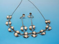 An Art and Crafts silver necklace and matching screw back earrings all set with paired blister