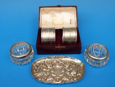 A cased pair of hallmarked silver napkin rings, Victorian hallmarked embossed tray,