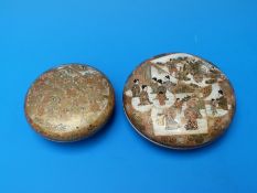 A finely decorated Japanese cylindrical lidded pot with highly gilded decoration of immortals,