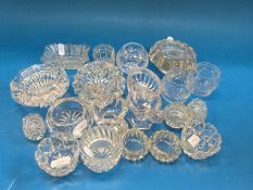 A collection of 20 pressed glass salts of various sizes