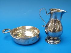 A feature hallmarked silver tastevin with snake handles together with a Britannia standard