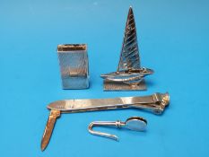 Novelty silver items including cigar cutter, money clip,