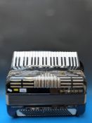 A Hohner Imperator V 120 bass five voice piano accordion,