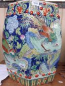 A Chinese garden seat with all over bird and floral decoration on a blue ground (47cm tall)
