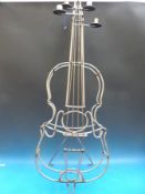 A candle holder formed as a cello