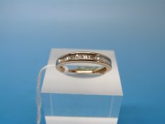 A yellow metal ring marked 10K set with diamonds (size N)