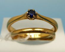 A 22ct gold wedding band (size K)and a 22ct gold ring set with a sapphire (size N)