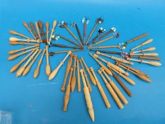 A quantity of lace makers' bobbins,