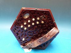 A Lachenal 21 key concertina (c1900s) with rosewood fretworked ends,