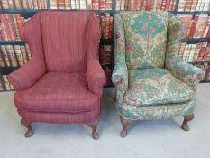 A pair of 19thC carved walnut wing back armchairs
