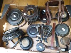 A collection of Chinese and Oriental hardwood stands including some shaped,