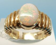A 9ct gold ring set with an oval opal (size L)