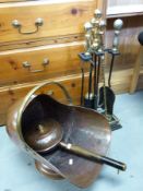 A copper coal scuttle together with a companion set etc