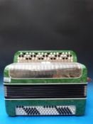 An early 1960s chromatic three row button accordion, Russian made 'Melody' 100 bass buttons,