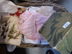 Two baskets of vintage linen and lace including collars, beadwork,
