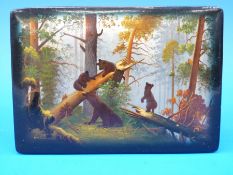 A Russian lacquer Fedoskino box with bear and cubs playing in a woodland landscape 