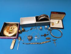 A hallmarked silver bangle, a white metal bangle marked sterling, compact, rolled gold bangle,