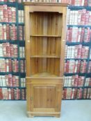 A pine corner cupboard