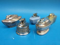 A collection of vintage table lighters including Wedgwood, onyx, Rolstar,